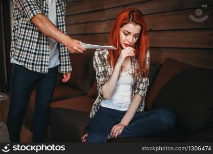 Young woman crying, man leaves the house, family quarrel, couple in conflict. Problem relationship