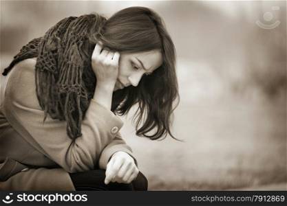 Young Woman Crying Outdoors in the Dark Autumn Day