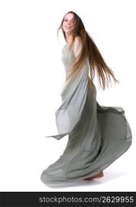 Young woman dancing in against white background