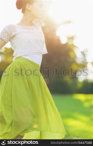 Young woman dancing on forest