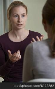 Young Woman Discussing Problems With Counselor