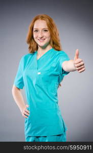 Young woman doctor in medical concept