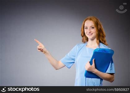 Young woman doctor in medical concept