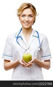 Young woman doctor isolated on white background holding apple. Woman doctor standing on white background
