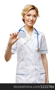 Young woman doctor isolated on white background holding card. Woman doctor standing on white background
