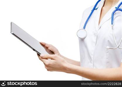 Young woman doctor isolated on white background holding tablet pc. Woman doctor standing on white background
