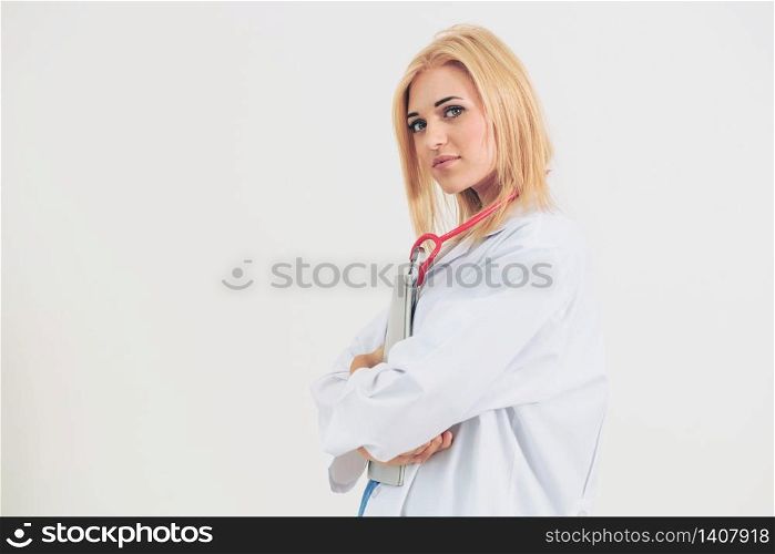 Young woman doctor portrait standing on a white background.. Young woman doctor portrait on a white background.