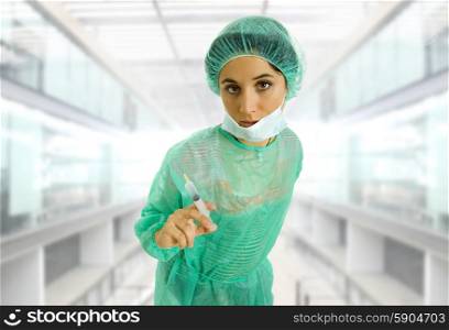 young woman doctor portrait with a syringe