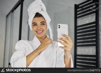 young woman doing beauty live with her phone