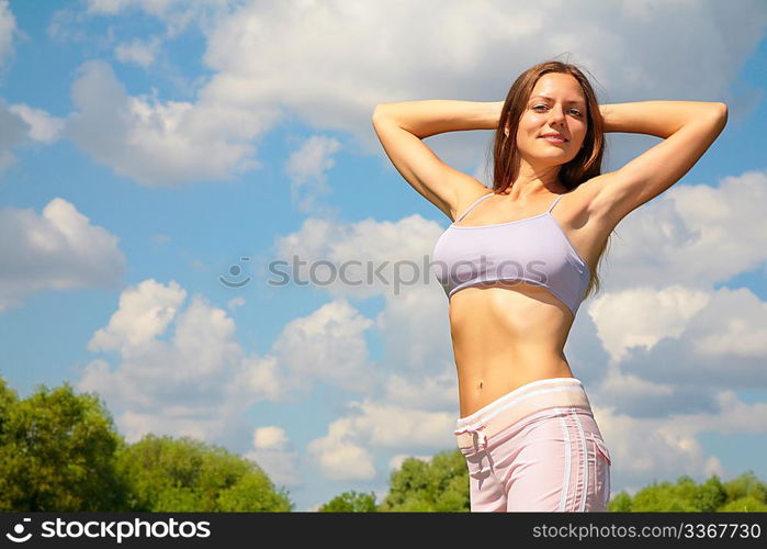 Young woman doing exercise in park