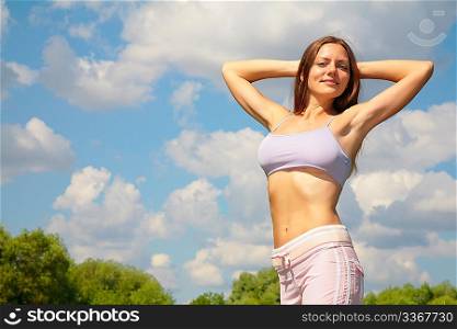 Young woman doing exercise in park