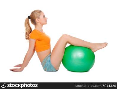 Young woman doing gymnastic exercises isolated