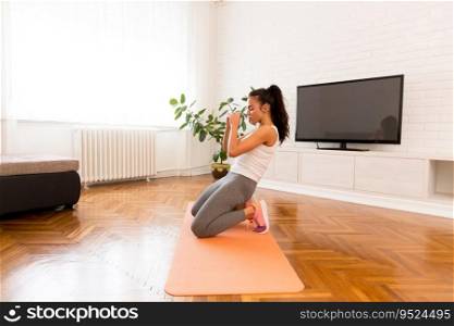 Young woman doing morning exercise in the room