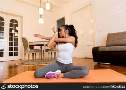 Young woman doing morning exercise in the room