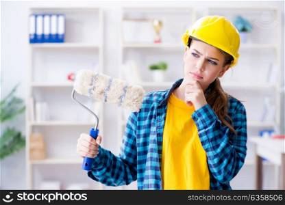 Young woman doing painting at home