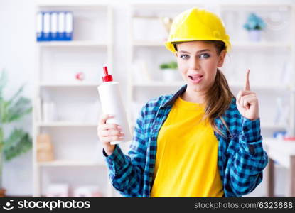 Young woman doing painting at home. The young woman doing painting at home