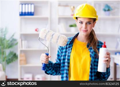 Young woman doing painting at home. The young woman doing painting at home