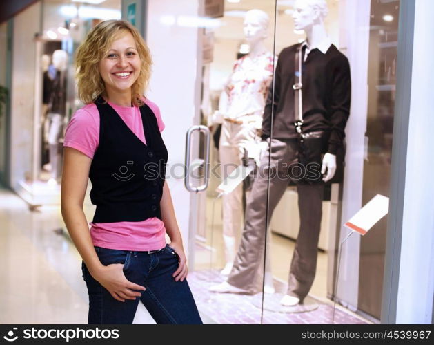 Young woman doing shopping and choosing clothes