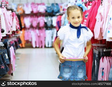 Young woman doing shopping and choosing clothes