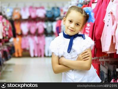 Young woman doing shopping and choosing clothes