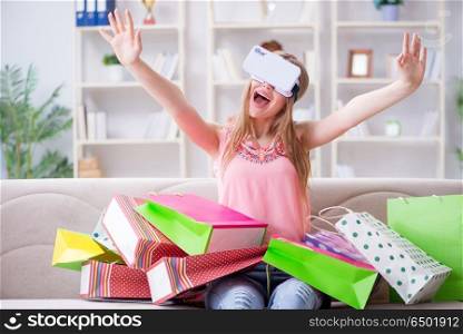 Young woman doing shopping with virtual reality glasses
