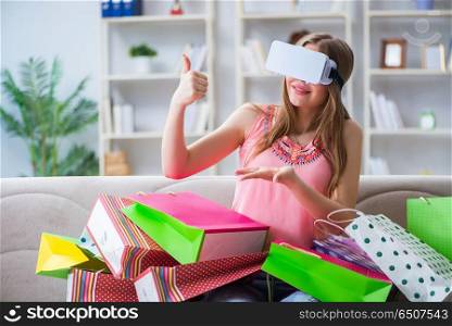 Young woman doing shopping with virtual reality glasses