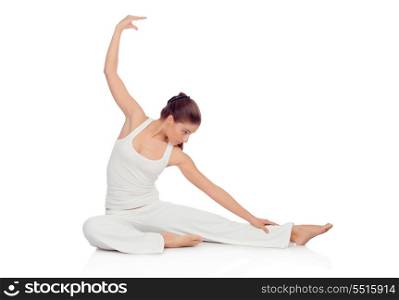 Young woman doing stretching exercises on the floor isolated on white background