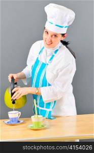 young woman dressed as a cook serving tea