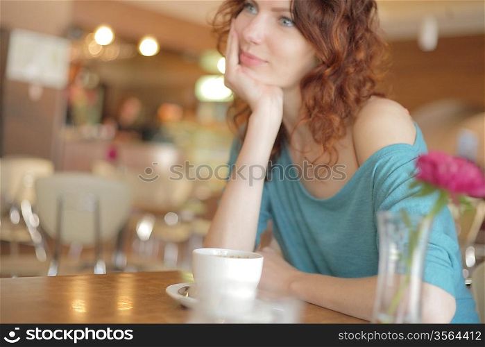 Young woman drinking a tea
