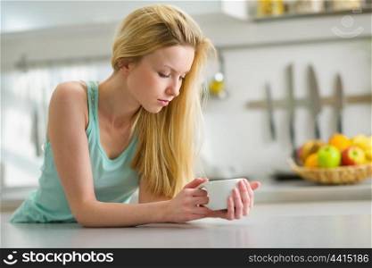 Young woman drinking coffee in the morning