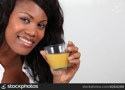 young woman drinking orange juice