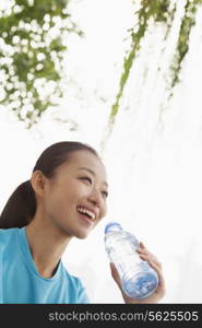 Young woman drinking water