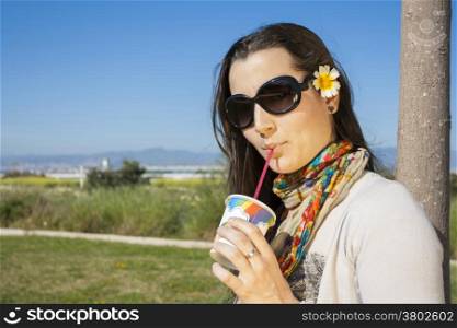 Young Woman drinking with straw