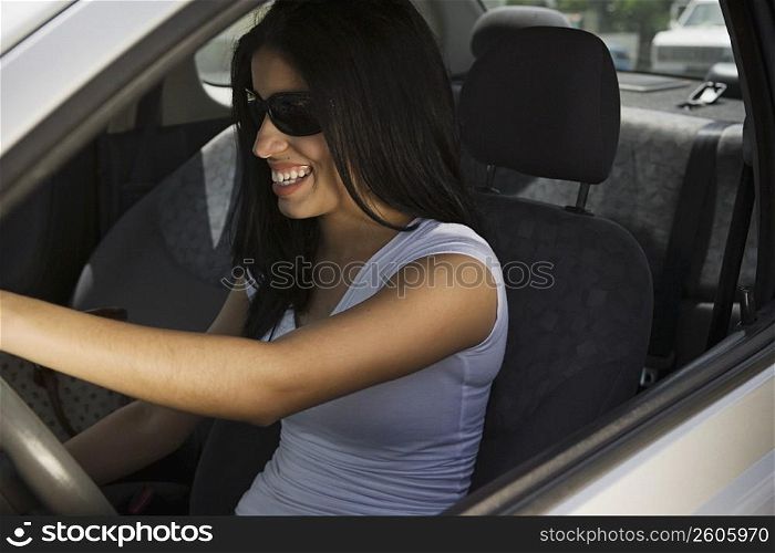 Young woman driving car
