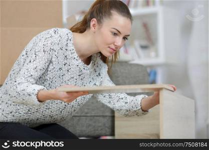 young woman during furniture installation