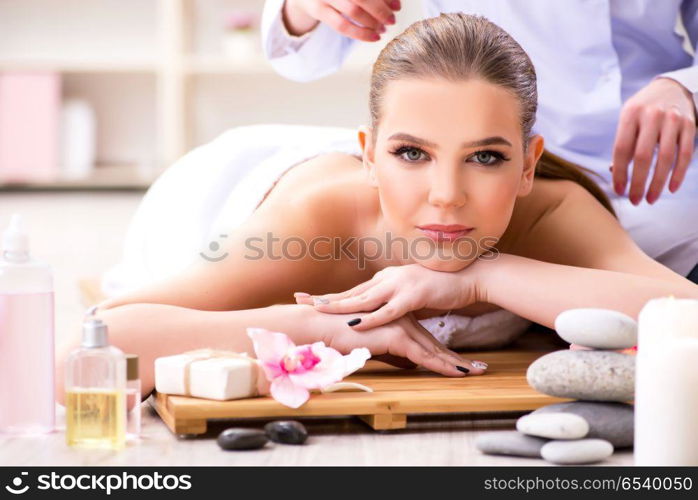 Young woman during spa procedure in salon