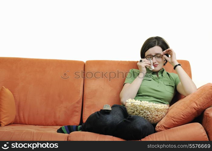 young woman eat popcorn, watching movies and eat popcor isolated on white