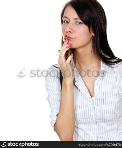 Young woman eating a chocolate candy, isolated on white