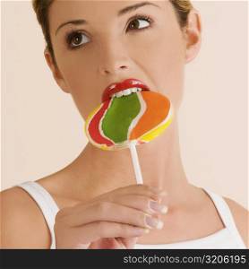 Young woman eating a lollipop