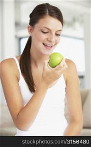Young Woman Eating An Apple