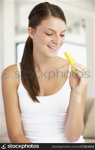 Young Woman Eating Fresh Pineapple