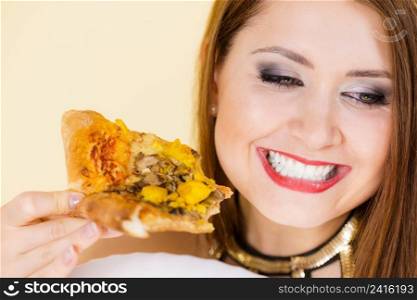 Young woman eating hot fresh pizza slice. Delicious fast food meal. People, italian cuisine concept.. Woman eating hot pizza slice