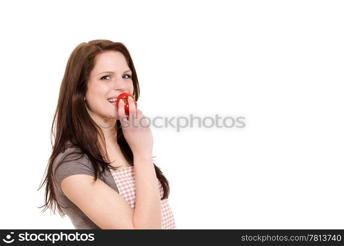 young woman eating tomato. happy young woman about to eat a tomato on white background