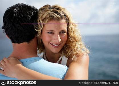 Young woman embracing her boyfriend