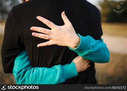 Young woman embracing her boyfriend. Lovely couple