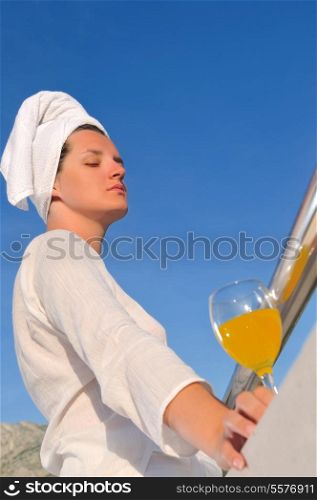 young woman enjoy sum and juice at summer location