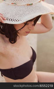 Young woman enjoying a summer day in a pool