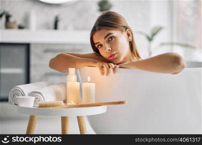 young woman enjoying bath alone