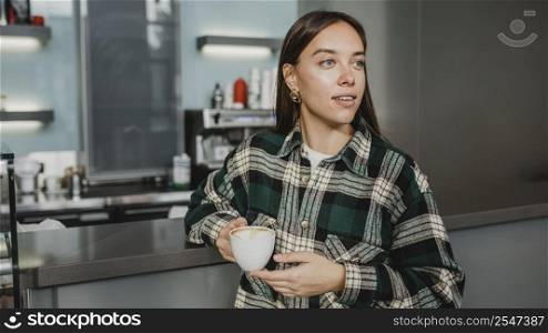 young woman enjoying coffee break