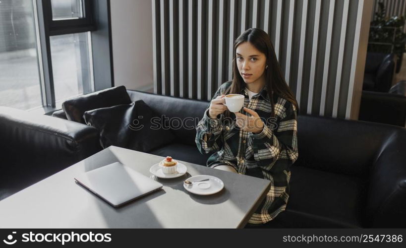 young woman enjoying coffee break 3